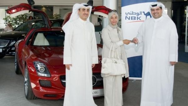 The winner Amina Al Zaidan receives the SLS keys from NBK General Manager, Consumer Banking Group Mazin Saad Al Nahedh and NBK Deputy General Manager, Consumer Banking Group Abdulla Al Najran Al Tuwaijri The winner Amina Al Zaidan receives the SLS keys from NBK General Manager, Consumer Banking Group Mazin Saad Al Nahedh and NBK Deputy General Manager, Consumer Banking Group Abdulla Al Najran Al Tuwaijri