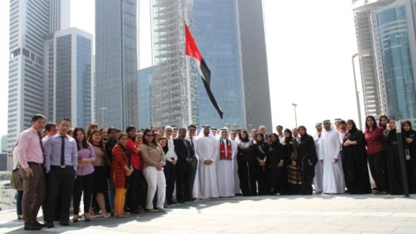 DPG CEO Khalid Al Malik and DPG staff raise the UAE Flag to Honour HH Campaign DPG CEO Khalid Al Malik and DPG staff raise the UAE Flag to Honour HH Campaign