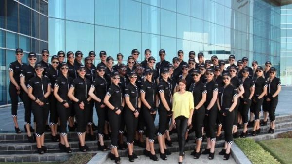 Dannii Minogue at Etihad Airways Headquarters in Abu Dhabi with the airline’s Grand Prix grid girls