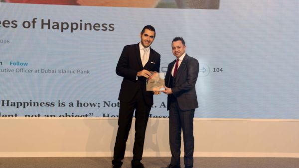 Dr. Adnan Chilwan, Group Chief Executive Officer at DIB, receiving the award