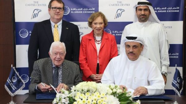 During the signing of the agreement between former U.S. President Jimmy Carter, founder of The Carter Center, and Mohamed Ali Al Ansari, Chairman of Al Ansari Exchange