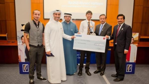 Emirates NBD senior managers and Dubai Expo 2020 Ambassadors with the winners of “Banker for a Day” and their family members