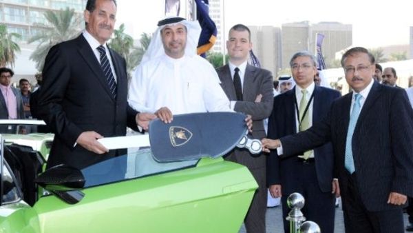 Emirates NBD top officials handing the keys of the Lamborghini Gallardo to Latif Mohammad Emirates NBD top officials handing the keys of the Lamborghini Gallardo to Latif Mohammad