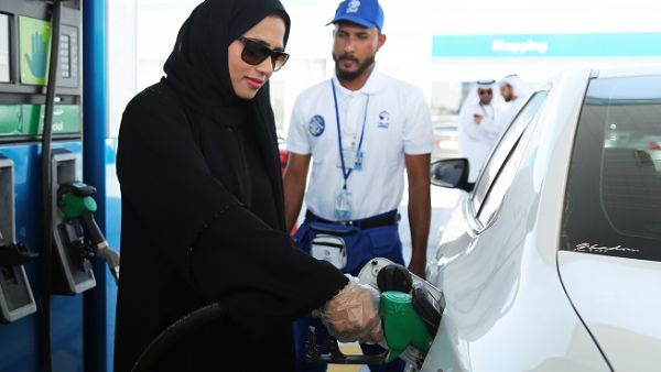 Emirati woman chooses Self Service option at ADNOC service stations. Emirati woman chooses Self Service option at ADNOC service stations.