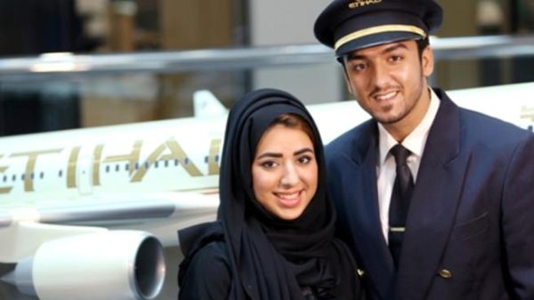 Noora Al Marri, Etihad Airways’ 1,000th Emirati member of staff, with her husband, Faisal Al Naqbi, an officer cadet from batch 19 of the cadet pilot program