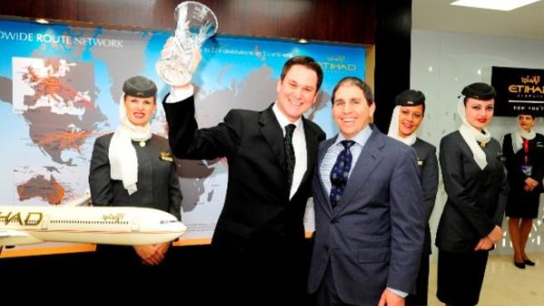Etihad Airways Chief Commercial Officer Peter Baumgartner receives the award from Global Vice President Expedia Media Solutions Noah Tratt