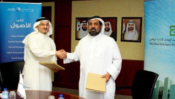 Salem Al Qubaisi, acting Chief Executive officer of Abu Dhabi Retirement Pensions & Benefits Funds and Dhafer Luqman Head of Products & Retail International at ADIB