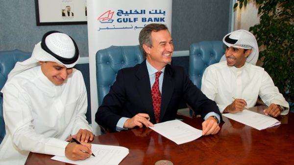 Gulf Bank CEO Cesar Gonzalez-Bueno at the signing ceremony with Ahmed Al Majed and Ahmed Al Huzami