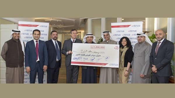 Al Danah Millionaire Mr. Ramadan Ali Hassan Al-Sharah receives his cheque from Gulf Bank’s CEO, Mr César González-Bueno and the bank’s team 