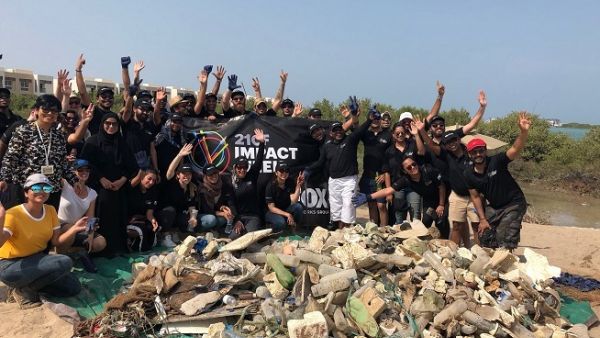 Group Photo During the cleanup at Khor Muzahmi in Mina Al Arab