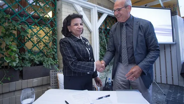 Dr. Sohair Wastawy, Executive Director of Qatar National Library (QNL), and Elliott Shore, a representative of the Council on Library and Information Resources (CLIR).