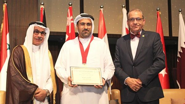 Rashed Al Ansari, General Manager of Al Ansari Exchange receiving the Golden Shield Award