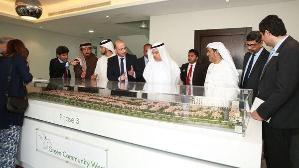 Khalid Bin Kalban and other officials viewing the model of Green Community West DIP-Phase III