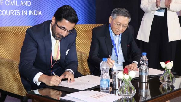 Moazzam Khan, Head, Global Litigation Practice, Nishith Desai Associates, with Michael Hwang SC, Chief Justice, DIFC Courts.