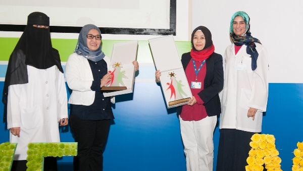 Dr. Manal Zaidan poses in a group photo with staff members during the celebration Dr. Manal Zaidan poses in a group photo with staff members during the celebration