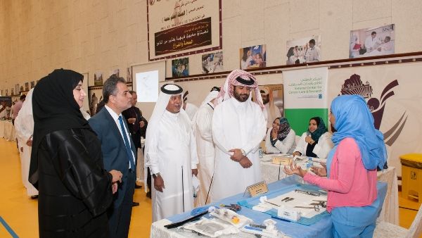 Officials visit a stand during the exhibition Officials visit a stand during the exhibition