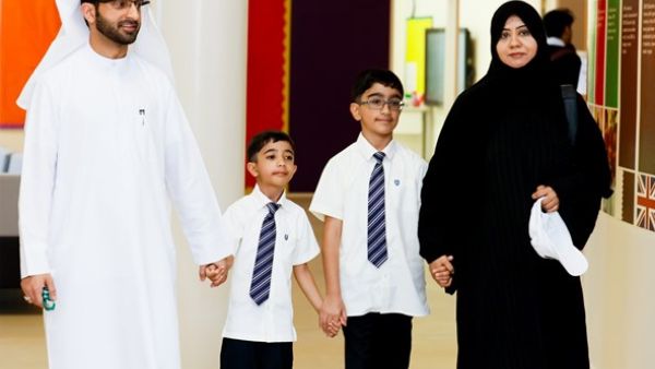 Parents with their children who received the scholarship.