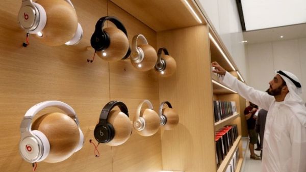 A customer looks at products displayed during the opening day of an Apple store at the Mall of the Emirates in Dubai on October 29, 2015. (AFP/ File)