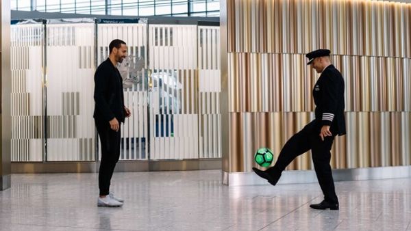 Former England international and Manchester United legend Rio Ferdinand (L) showing off some of his football skills.