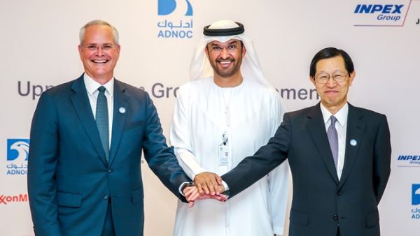 Sultan Ahmed Al Jaber, UAE Minister of State and Group CEO of ADNOC, with Darren W. Woods, Chairman and Chief Executive Officer of Exxon Mobil Corporation and Toshiaki Kitamura, President and Chief Executive Officer of INPEX, after the signing ceremony.