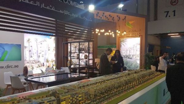 Visitors at the DIRC Mirdif Hills stand during Cityscape Abu Dhabi