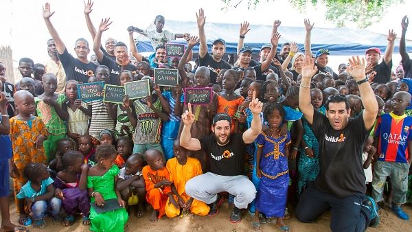Volunteers with Senegalese children
