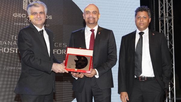 Yasser Zeineldin, CEO, eHosting DataFort (center) receiving the Top Managed Service Provider of the Year