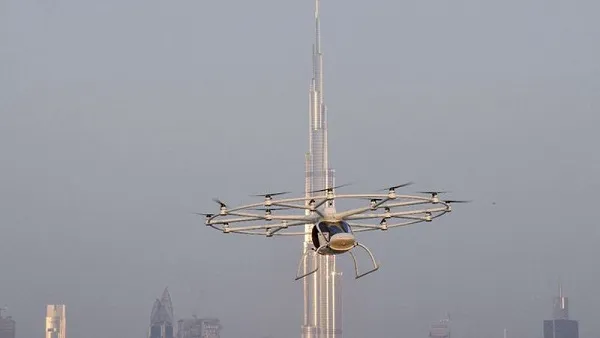 A video shows the flying taxi whirring through the sky before returning to base. (Gulf Business)