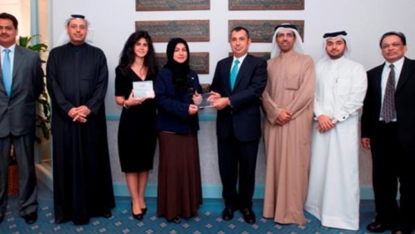 A group photo of Gulf Bank’s team receiving two Quality Recognition awards from Citibank representatives