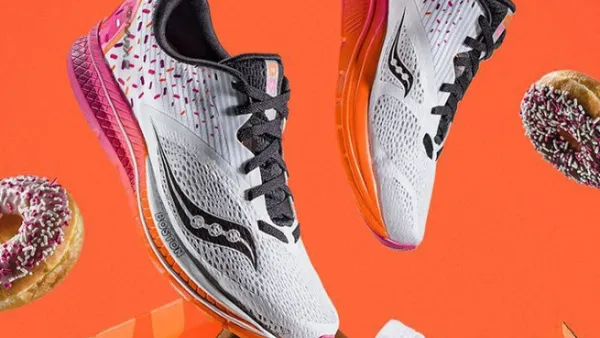 The Saucony x Dunkin' Kinarvara 9 shoes come in a box modeled after a Dunkin' Donuts box and feature the colors of the eatery's logo and a sprinkle-inspired design. (Courtesy of Saucony)