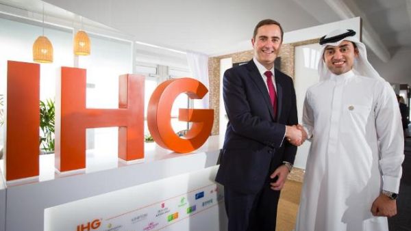 Pascal Gauvin and Sami Alhokair shake hands after signing the agreement. (Courtesy of IHG)