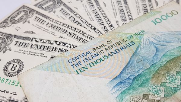 The dollar was selling for 65,000 rials, according to foreign exchange website Bonbast.com, which tracks the free market. (Shutterstock)