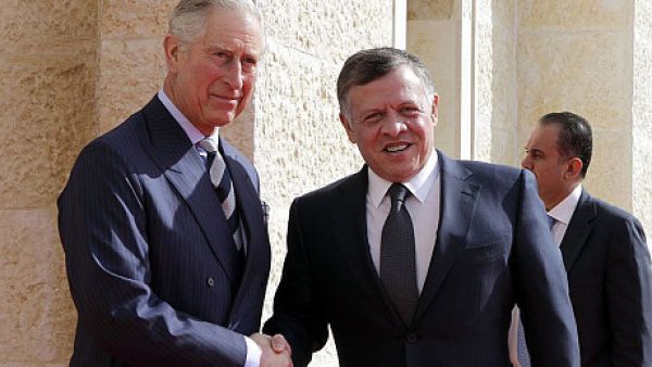 King Abdullah II greets the Prince of Wales outside Al Husseiniya Palace. (AFP/File)