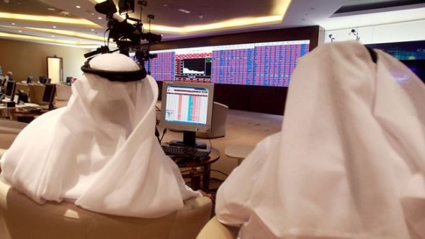 Traders monitor screens displaying stock information at Qatar Stock Exchange in Doha on June 5, 2017. (Reuters) Traders monitor screens displaying stock information at Qatar Stock Exchange in Doha on June 5, 2017. (Reuters)