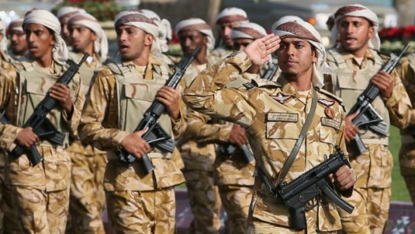 Qatari army forces take part in a military parade during the Gulf emirate's National Day celebrations in Doha on December 18, 2013. (AFP/Karim Jaafar)