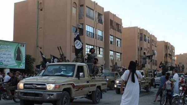 Daesh militants parade through the streets of Raqqa. (AFP/File)