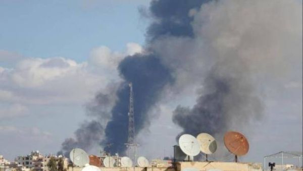 Smokes rises from the city of Raqqa after a US-backed airstrike. (AFP/File)
