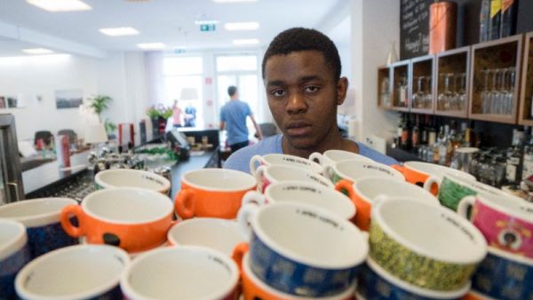 Daniel Bapinga from DR Congo prepares a coffee in the lobby bar of hotel Magdas in Vienna, Austria. (Courtesy photo)