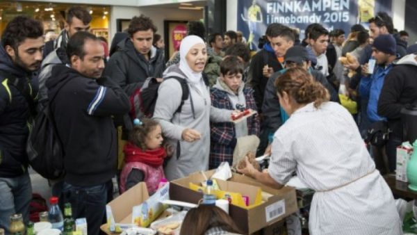 Refugees receiving emergency food upon arriving in Sweden. (AFP/File)