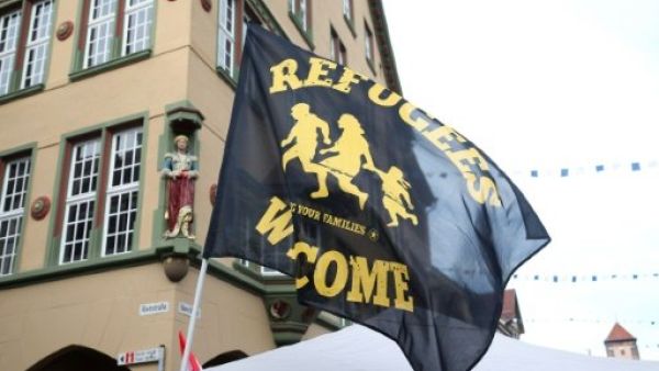 A flag reading "Refugees Welcome" is seen at a demonstration in Villingen-Schwenningen, southern Germany, on January 30, 2016. (AFP/File)