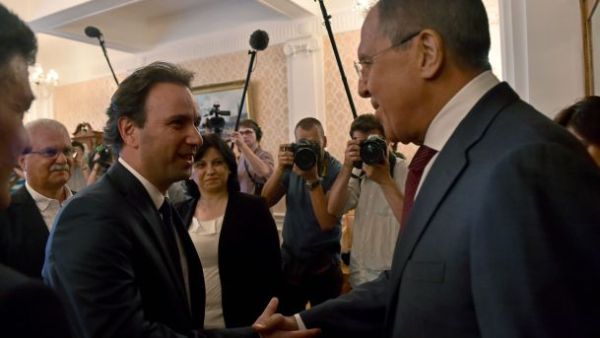 Russian Foreign Minister Sergei Lavrov (R) welcomes Syrian Opposition Council President Khaled Khoja during their meeting in Moscow. (AFP/File)