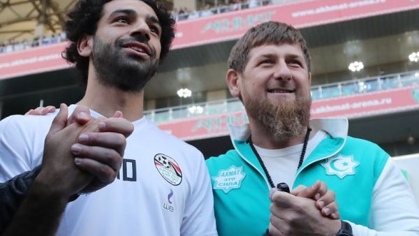 Egyptian national football team player and Liverpool's star striker Mohamed Salah (L) poses with head of the Chechen Republic Ramzan Kadyrov during a training at the Akhmat Arena stadium in Grozny on June 10, 2018, ahead of the Russia 2018 World Cup. Egypt's national football team will use the venue as their base camp training site.
KARIM JAAFAR / AFP