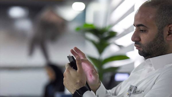 A man playing with his phone (AFP/File Photo)