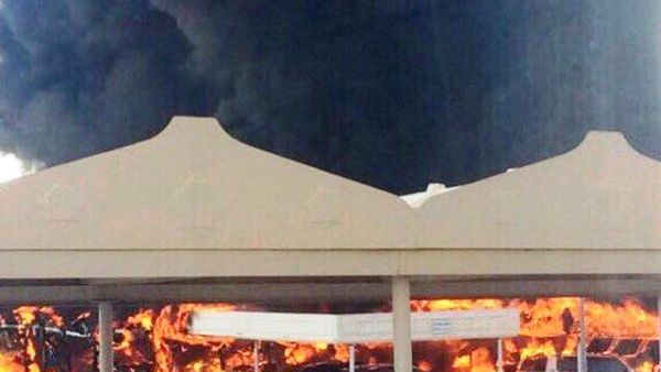Firefighters controlled the blaze that engulfed 19 cars in a University of Sharjah parking lot. (Twitter)