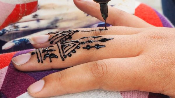 Henna tattoos being put on girls hand in Morocco. (Shutterstock/ File Photo)