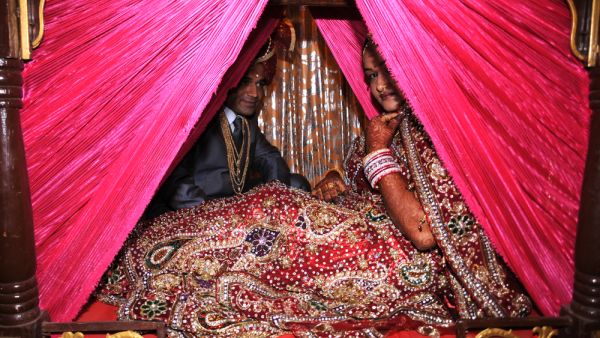 Indian people doing Wedding Rituals (Shutterstock)	