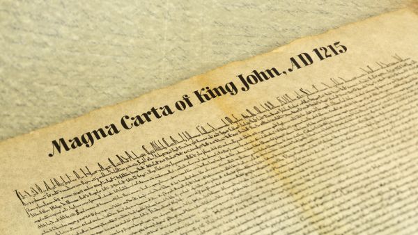 Magna Carta Libertatum, is an eight-hundred year-old English legal charter that required King John of England to proclaim certain rights and accept that his will could be bound by the law. (Shutterstock)