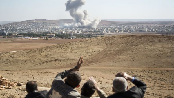 Smoke rises in Syria, after an airstrike (Shutterstock)	