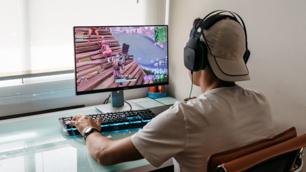 Teenager playing Fortnite video game (Shutterstock)