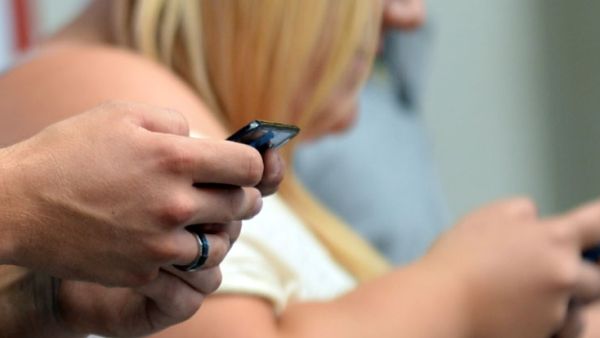 A clerk blackmailed and threatened to defame an air hostess by sending her private photos to her ex-husband (AFP/File Photo)